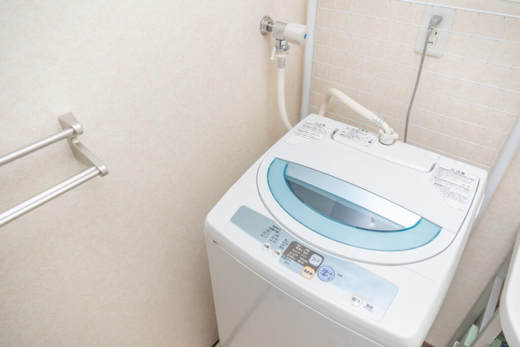 Thorough removal of black mold inside a top-load washing machine through disassembly cleaning